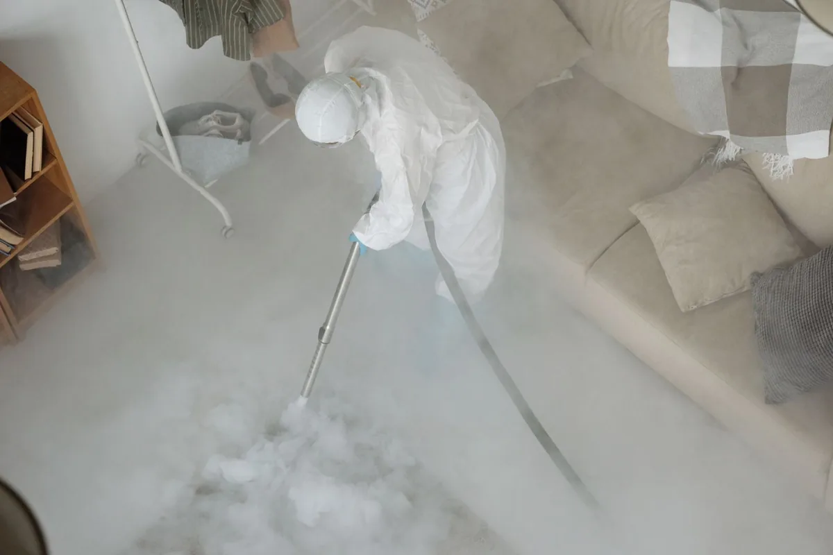 Biohazard cleanup technician in protective equipment, Fruit Hill, OH